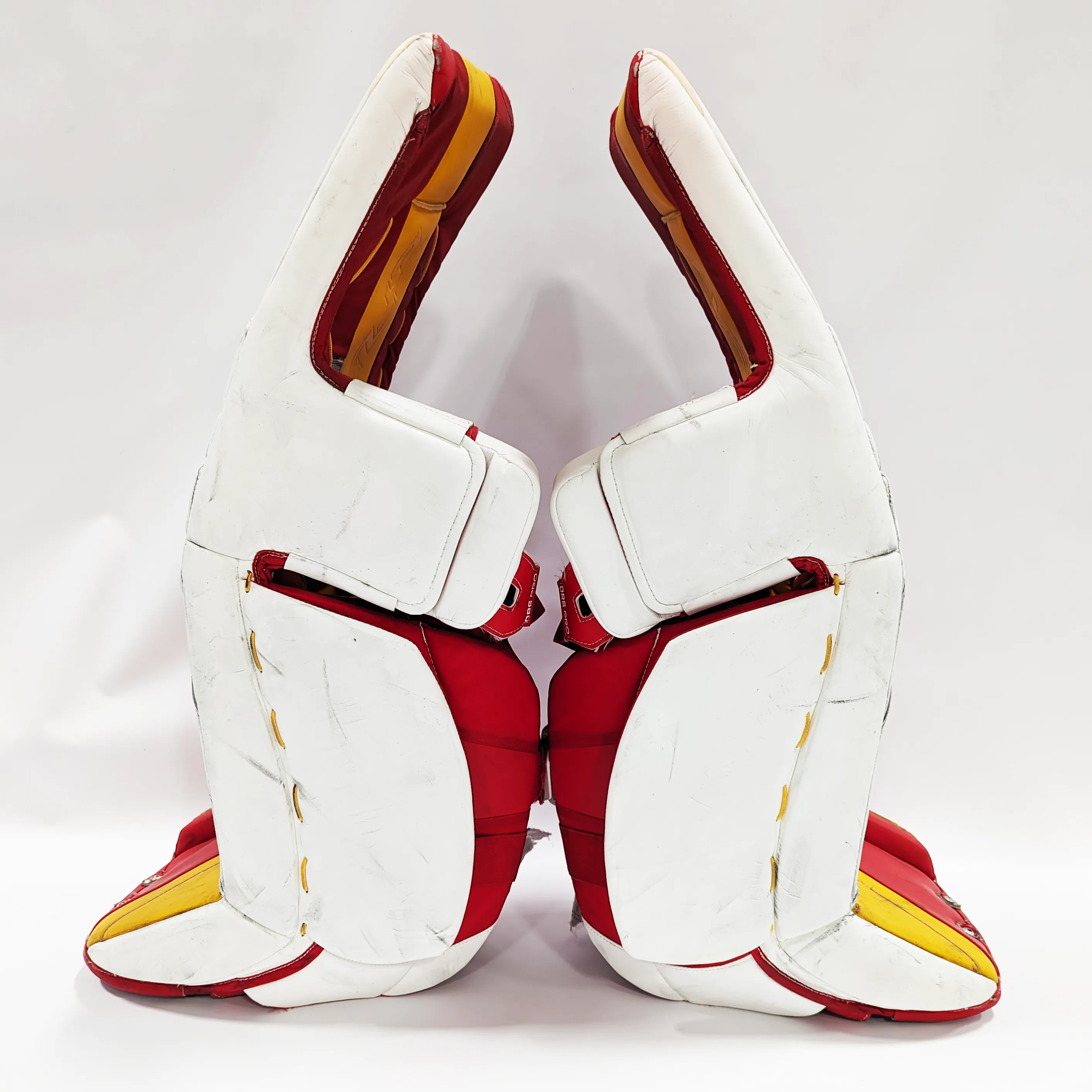 CCM Extreme Flex 6 - Used AHL Pro Stock Goalie Pads (White/Red/Yellow)